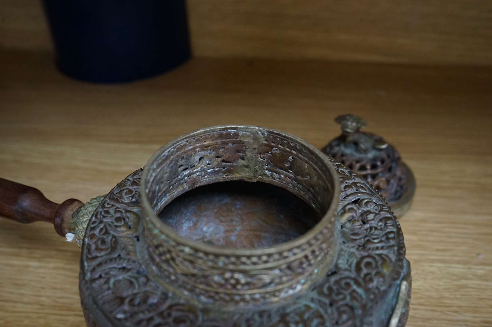 A Tibetan copper and brass pot and a similar box and cover with mirrored interior, largest 19cm high (2). Condition - poor to fair